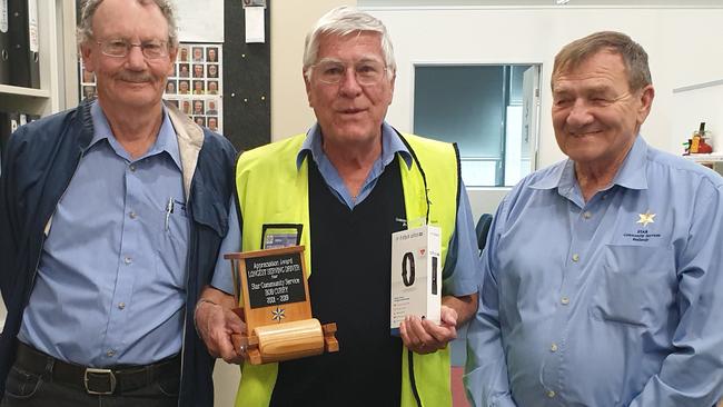 Longest-serving volunteer driver Bob Curry (centre) receives thanks from STAR Community Services chairperson Rob Spencer (left) and senior manager Warren Doyle.