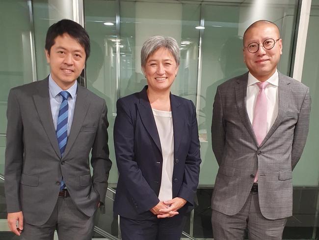 Ted Hui (left) and Kevin Yam with Foreign Minister Penny Wong in January at the Australian government offices in Adelaide. On Monday, the Hong Kong police announced they two have been accused of "collusion".  Picture - Supplied