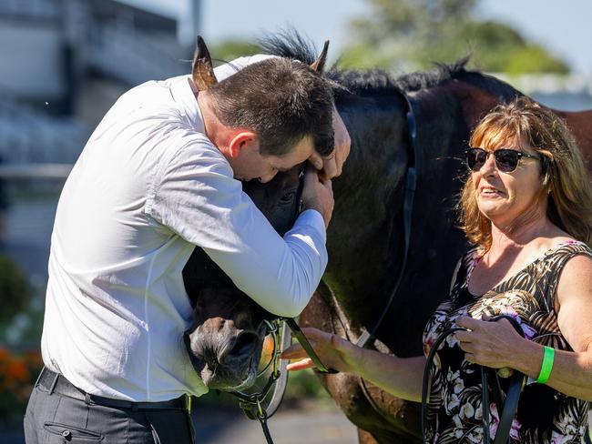 Trainer Patrick Kearney gives Yellowbrick Road a cuddle after his Lord Reims Stakes win. Picture: Makoto Kaneko