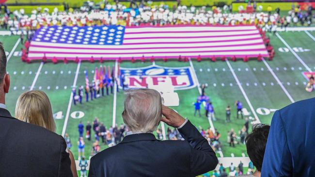 US President Donald Trump salutes as the national anthem is played before the start of Super Bowl LIX between the Kansas City Chiefs and the Philadelphia Eagles at Caesars Superdome in New Orleans, Louisiana, February 9, 2025. (Photo by ROBERTO SCHMIDT / AFP)