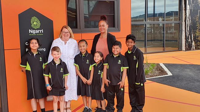 Ngarri Primary school principal Honey Stirling, Minister for Education Natalie Hutchins and some of the school's new students.