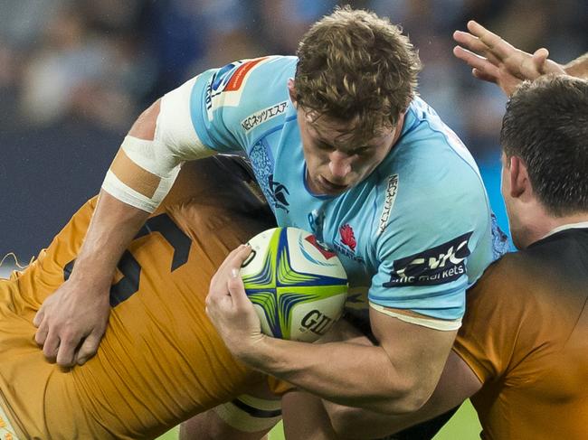 Michael Hooper of the Waratahs is tackled during the Round 15 Super Rugby match between the New South Wales Waratahs and the Jaguares at Bankwest Stadium in Sydney, Saturday, May 25, 2019. (AAP Image/Craig Golding) NO ARCHIVING, EDITORIAL USE ONLY