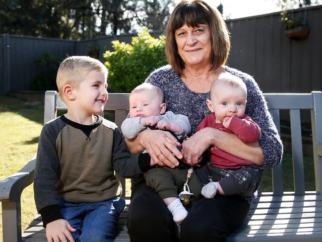 Kerry Rogers with her grandchildren Cooper 3, Charlie, four months and Marsden, three months, does not qualify for the PBS-listed drug because she was diagnosed more than two years ago. Picture: Tim Hunter.