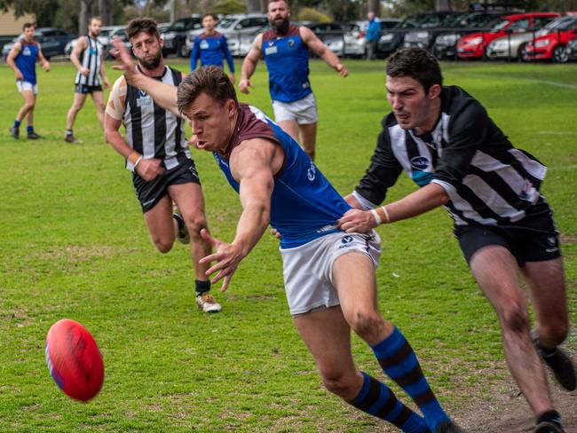 Old Peninsula's George Fletcher is tackled without the ball last season. Picture: Pearcey Photography