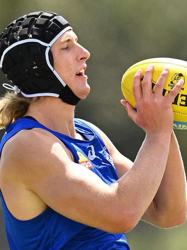 Aaron Naughton marks during his session with forwards coach Ash Hansen.