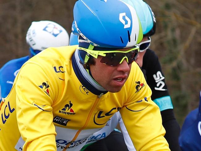 Australia's Michael Matthews rides in the pack wearing the overall leader's yellow jersey during the first stage of the 74th edition of the Paris-Nice cycling race between Conde-sur-Vesgre and Vendome on March 7, 2016. / AFP / KENZO TRIBOUILLARD