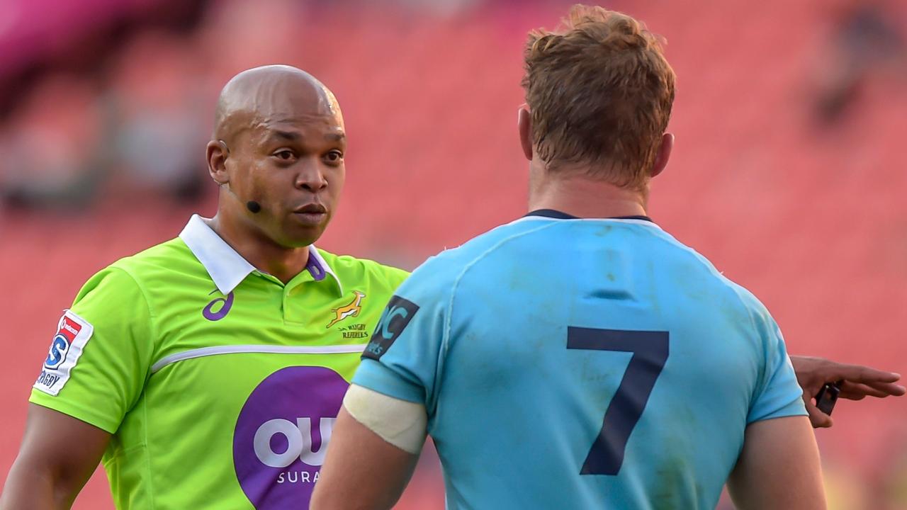 Referee Egon Seconds talks to Waratahs captain Michael Hooper in Johannesburg.