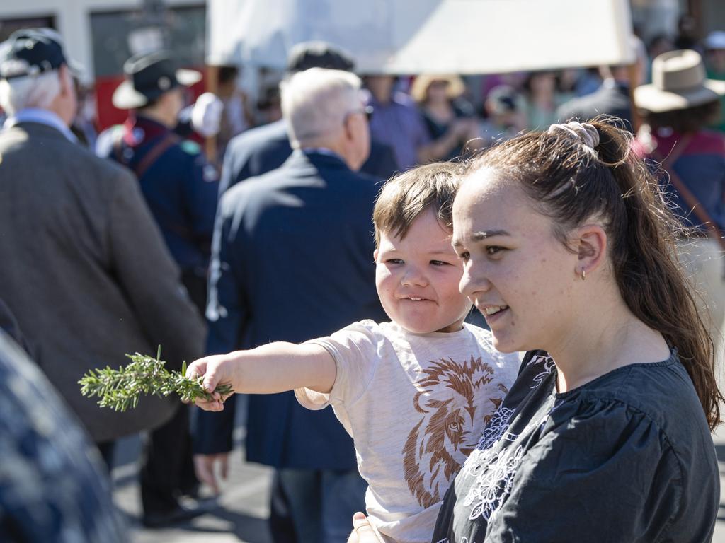 Chase and Sienna Reynolds watch Toowoomba's Anzac Day mid-morning march to the Mothers' Memorial, Thursday, April 25, 2024. Picture: Kevin Farmer