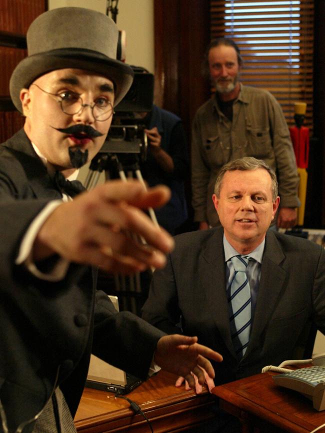 Then-premier Mike Rann, front right, with actor Nigel Martin and film director Rolf de Heer during filming of Dr Plonk in 2006.