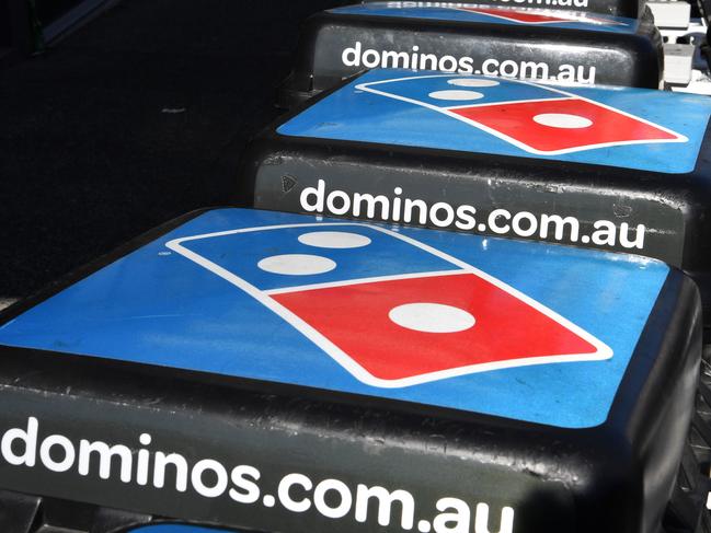 Domino's Pizza delivery bikes are seen outside a Domino's store in Brisbane, Tuesday, August 15, 2017. Shares in Domino's Pizza have fallen sharply after the fast food retailer's strong profit and sales growth missed its own forecasts and announced a $300 million share buyback after its shares have slipped about 22 per cent in the past eight months  (AAP Image/Darren England) NO ARCHIVING