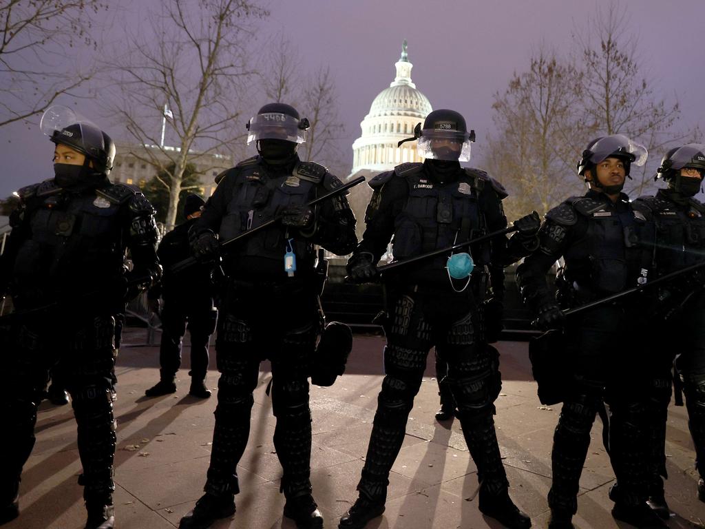 Police officers in riot gear line up as protesters gather on the U.S. Capitol Building. Picture: Getty