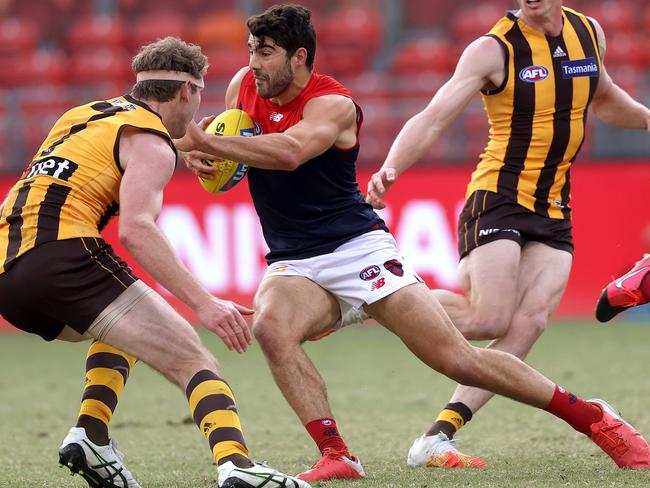 Christian Petracca has developed a dynamic sidestep in his game, breaking through a Hawthorn tackle at Giants Stadium earlier this year. Picture. Phil Hillyard