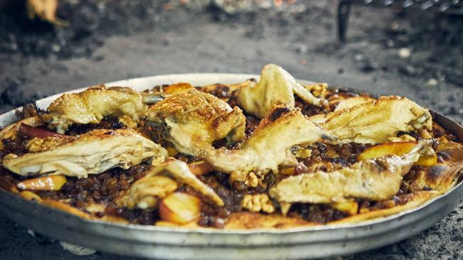 Ita chicken cooked in the ashes of a hearth at Trëndafili Mistik in Lezhë. Picture: Jenny Zarins.