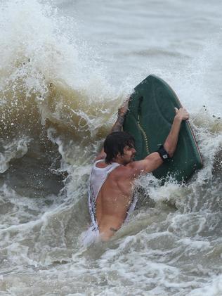 The Premier has slammed ‘appalling’ behaviour of those surfing and driving in the storm. Picture: Airlie Beach. Photographer: Liam Kidston