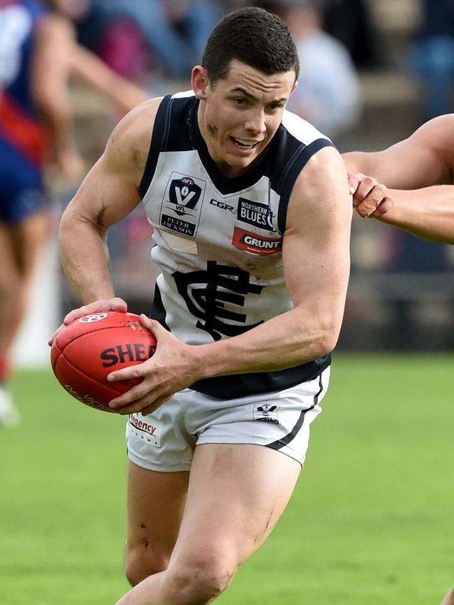 Northern Blues captain Tom Wilson charges away with possession. Picture: Kylie Else.