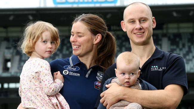 Hoare with husband Chris and children Edith and Conor after she was taken at pick one in the AFLW supplementary draft in April. Picture: Mike Dugdale