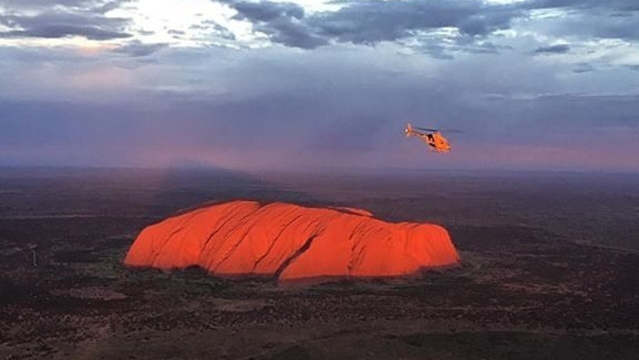 Professional Helicopter Services Uluru provides flights over the rock to take in its majestic size and amazing colour and formation. Picture: Supplied