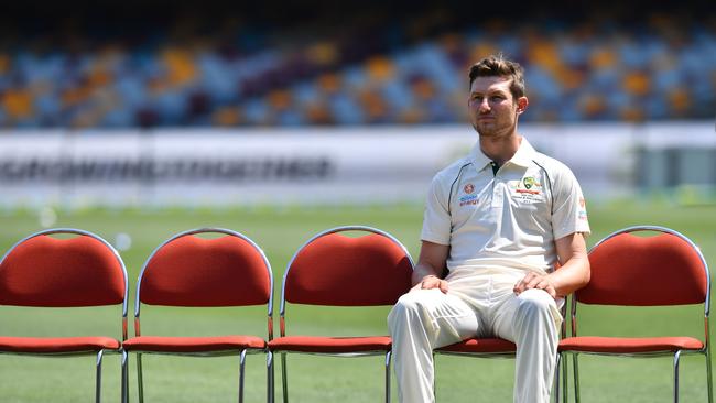 Cameron Bancroft is seen waiting for team mates before the team photo during the Australian Men's cricket team training session at the Gabba in Brisbane, Tuesday, November 19, 2019. Australia will take on Pakistan in the first test at the Gabba from Thursday.  (AAP Image/Darren England) NO ARCHIVING