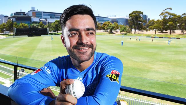 Superstar leg-spinner Rashid Khan who arrived Saturday night poses at the Karen Rolton Oval Pavilion during a practise match between Adelaide Strikers and the Perth Scorchers. Picture: Image AAP/Mark Brake.