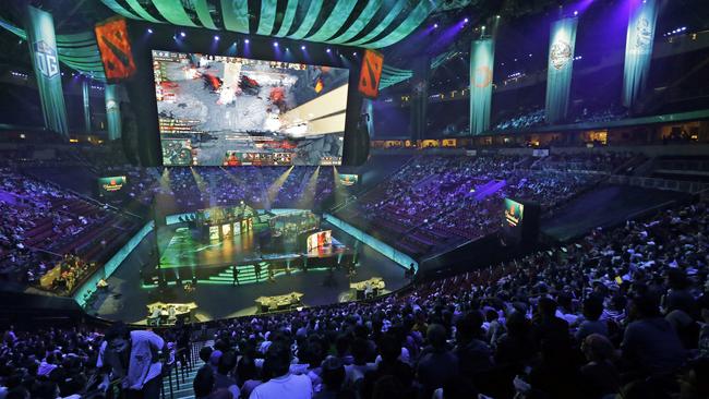 Fans look on at KeyArena during The International 2017, the world championship event for top esport Dota 2. (AP Photo/Elaine Thompson)