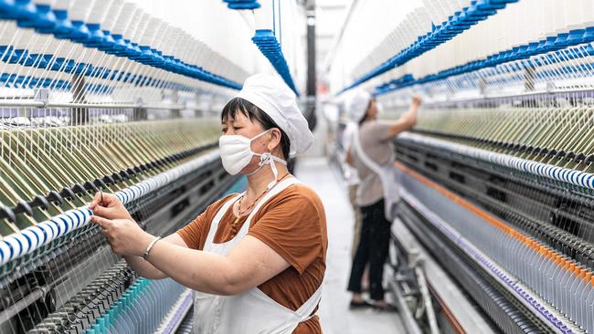 A worker at a textile company in China’s Jiangsu Province. Beijing has set an economic growth target of about 5.5% for this year. Picture: AFP