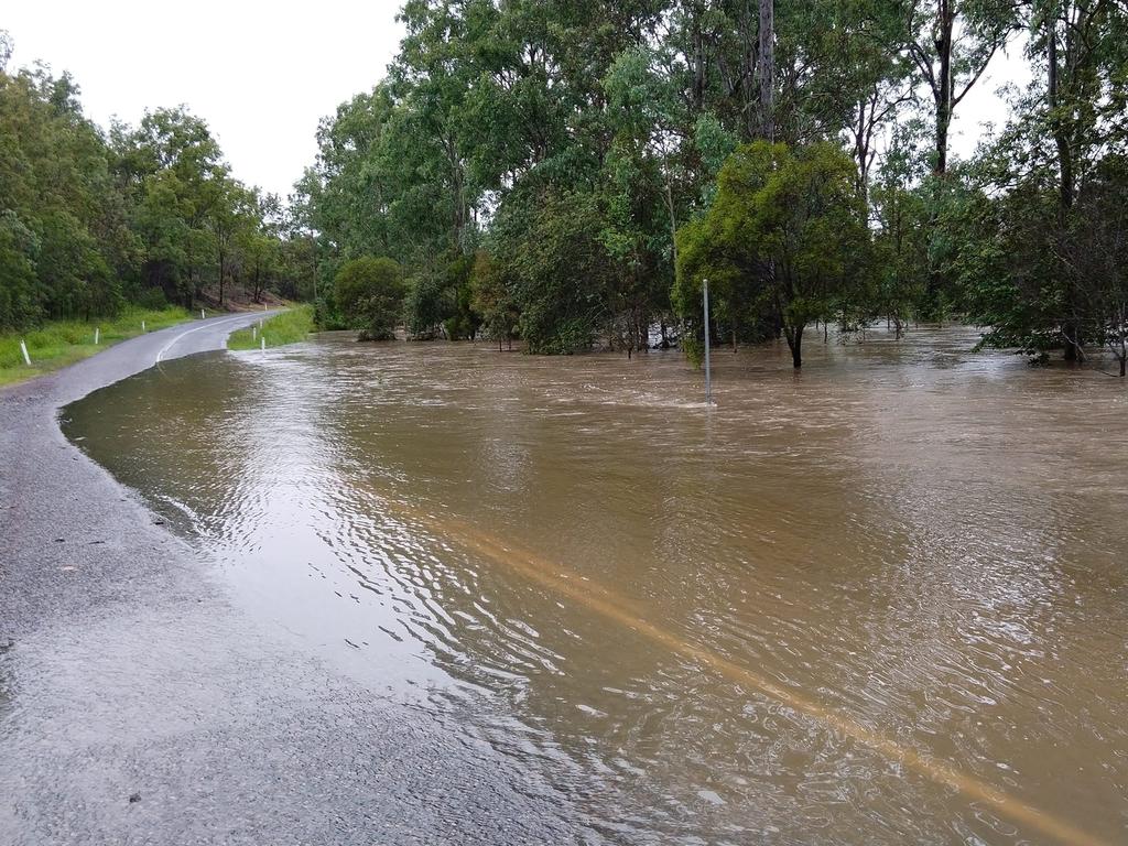 Photos of 1m of water over Beresford Rd Boompa on the Biggenden/Maryborough Rd. Picture: Hayden Beresford