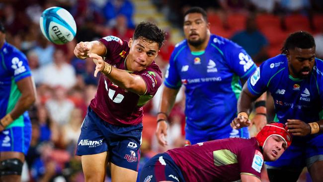 Queensland Red's Kalani Thomas makes a pass during the Super Rugby match between the Queensland Reds and Fijian Drua at Suncorp Stadium in Brisbane on March 12, 2022. (Photo by Patrick HAMILTON