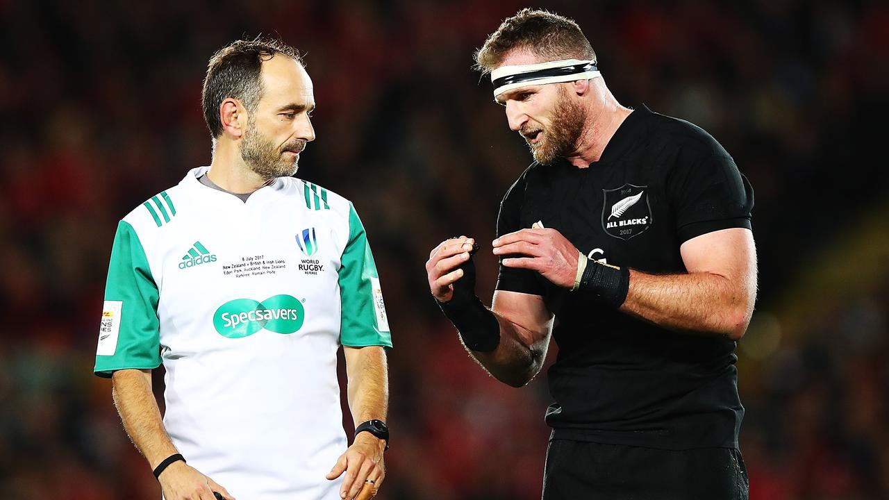 Kieran Read of the All Blacks talks to referee Romain Poite.