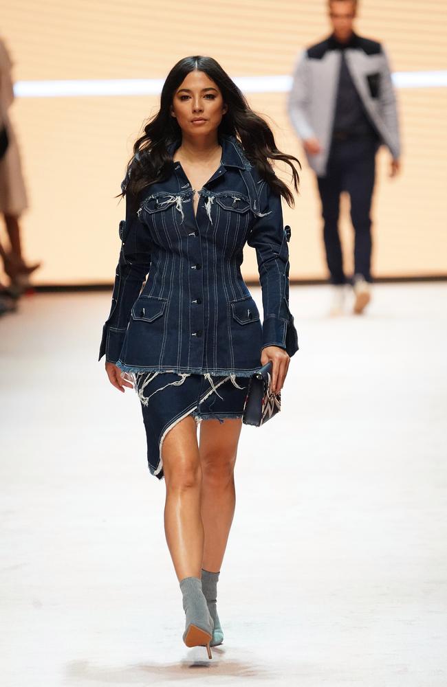 Jessica Gomes walks the runway to a packed crowd at the historic Royal Exhibition Building. Picture: AAP/Stefan Postles