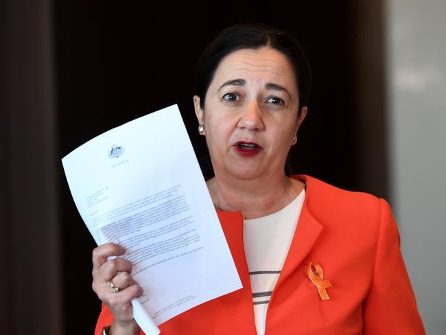 Queensland Premier Annastacia Palaszczuk holds a letter from Federal Treasurer Scott Morrison, who said the State Government had enough funds to secure the Dora The Explorer without the Federal Government lifting its location offset. Picture: AAP Image/Dan Peled.