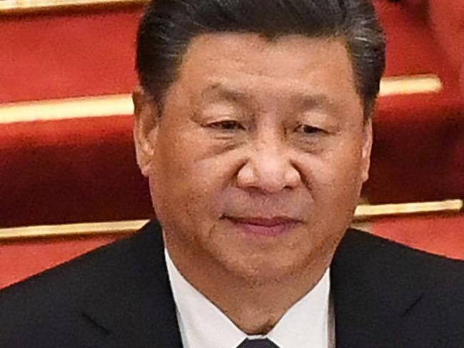 Chinese President Xi Jinping (L) and Premier Li Keqiang (R) arrive for the opening session of the Chinese People's Political Consultative Conference (CPPCC) at the Great Hall of the People in Beijing on May 21, 2020. (Photo by Leo RAMIREZ / AFP)