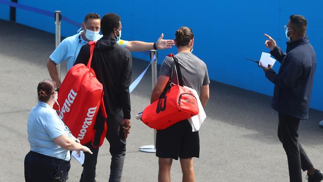 Tennis players arrive for training at Melbourne Park on Monday. Picture: Mike Owen/Getty Images