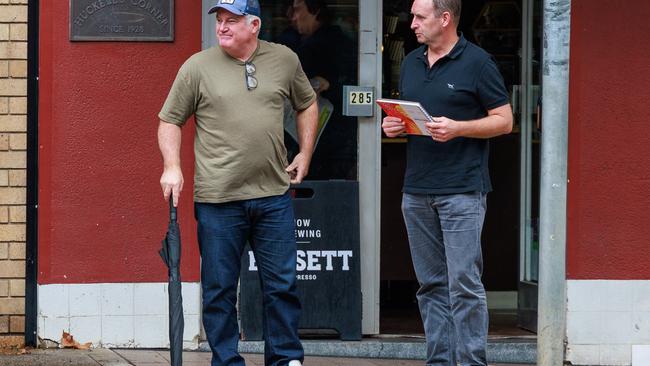 Stuart MacGill, left, was spotted leaving Crumbs coffee shop in the rain in Cremorne on Wednesday. Picture: Justin Lloyd.