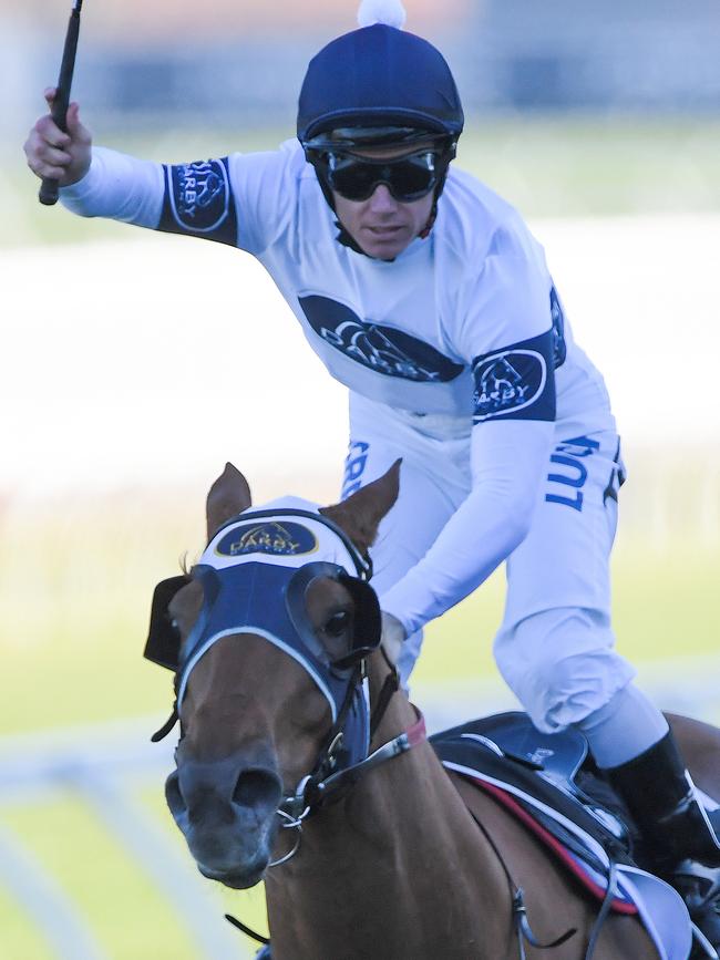 Tim Clark salutes after steering Samadoubt to a shock win in the Winx Stakes. picture: AAP