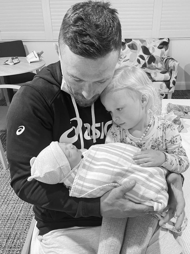 Rabbitohs hooker Damien Cook with daughter Willow and newborn son Jagger.