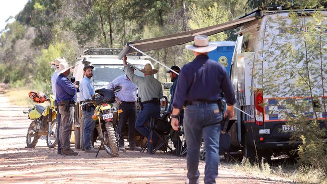 Police on the unsealed Wains Road, Wieambilla, leading to the property where two police officers and a neighbour were killed. Picture: Liam Kidston