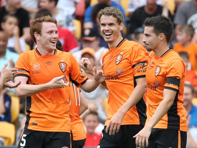 Thomas Kristensen (middle) celebrates his first goal. Brisbane Roar Vs Adelaide United. A-League. Pic Jono Searle.