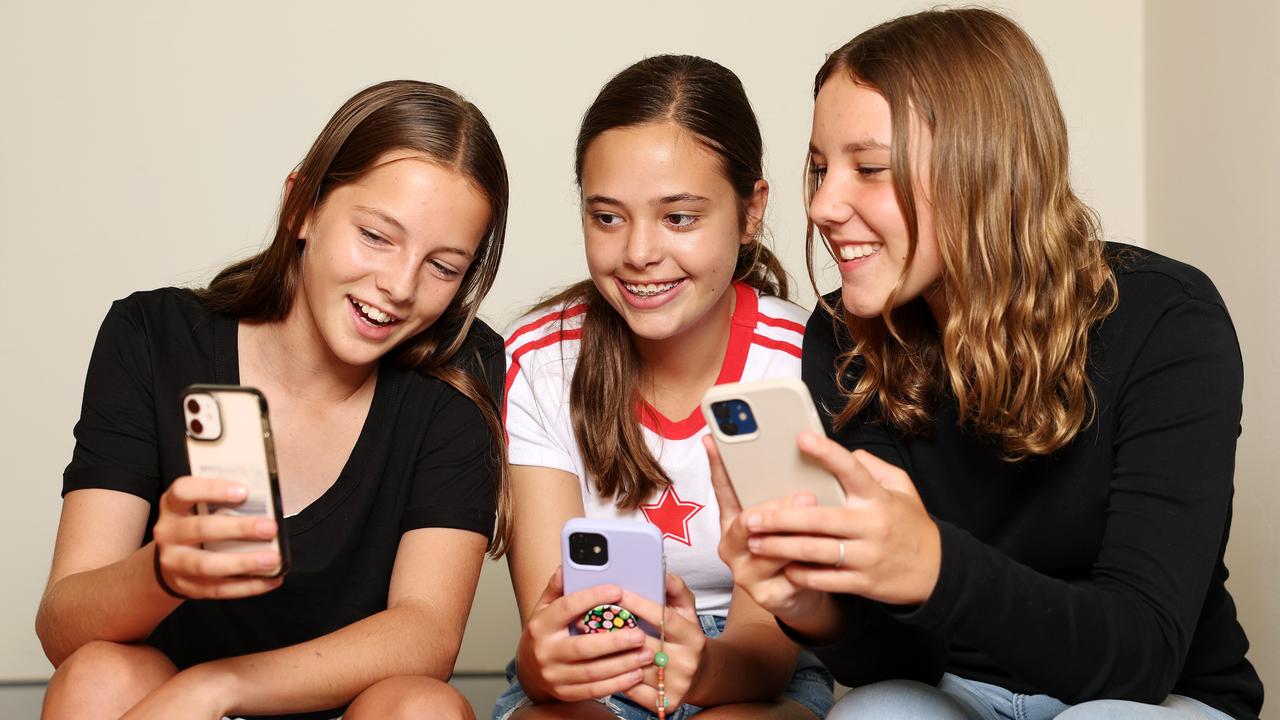 From left, teenagers Frankie Gibson, Maeya Cassim and Hazel Easter are in favour of time limits on their phones as a new pilot program aims to teach Aussie kids how to manage their online lives. Picture: Tim Hunter.
