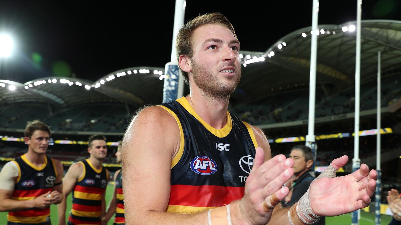 AFL - Saturday, 19th September, 2020 - Adelaide Crows v Richmond at the Adelaide Oval. Adelaide's Daniel Talia leads the team off in the last game of the year and his 200th game Picture: Sarah Reed