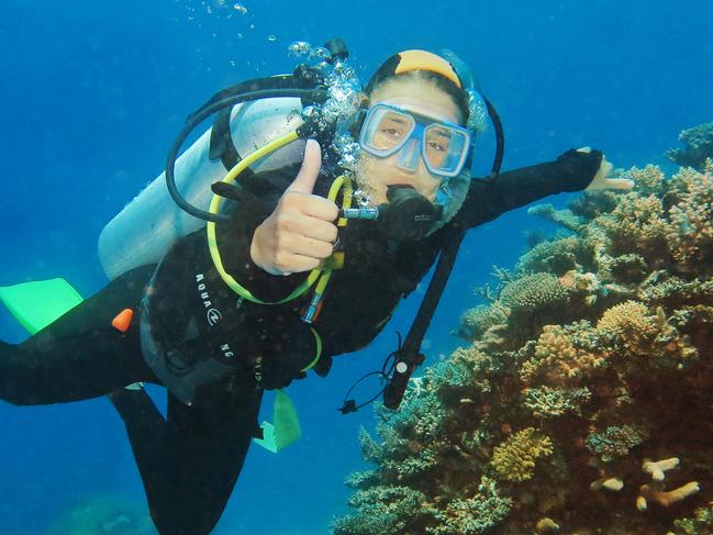 Dreamtime Dive and Snorkel are a new Reef tour operator in Cairns that showcase the indigenous cultures of far north Aborigines and Torres Strait Islanders. Norwegian tourist Asne Maeland scuba dives past hard and soft corals growing on Flynn Reef, part of the Great Barrier Reef marine park off the coast of Cairns. PICTURE: BRENDAN RADKE