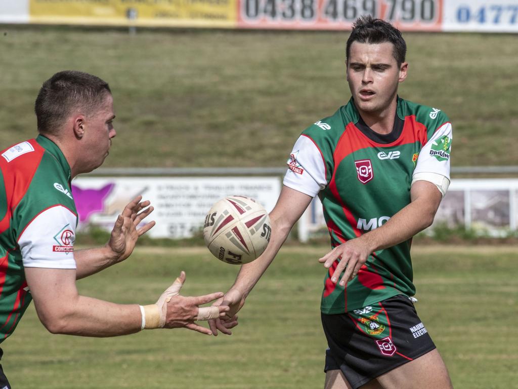 Laurie Jocumsen passes the ball to Nicholas Nairn for Pittsworth.