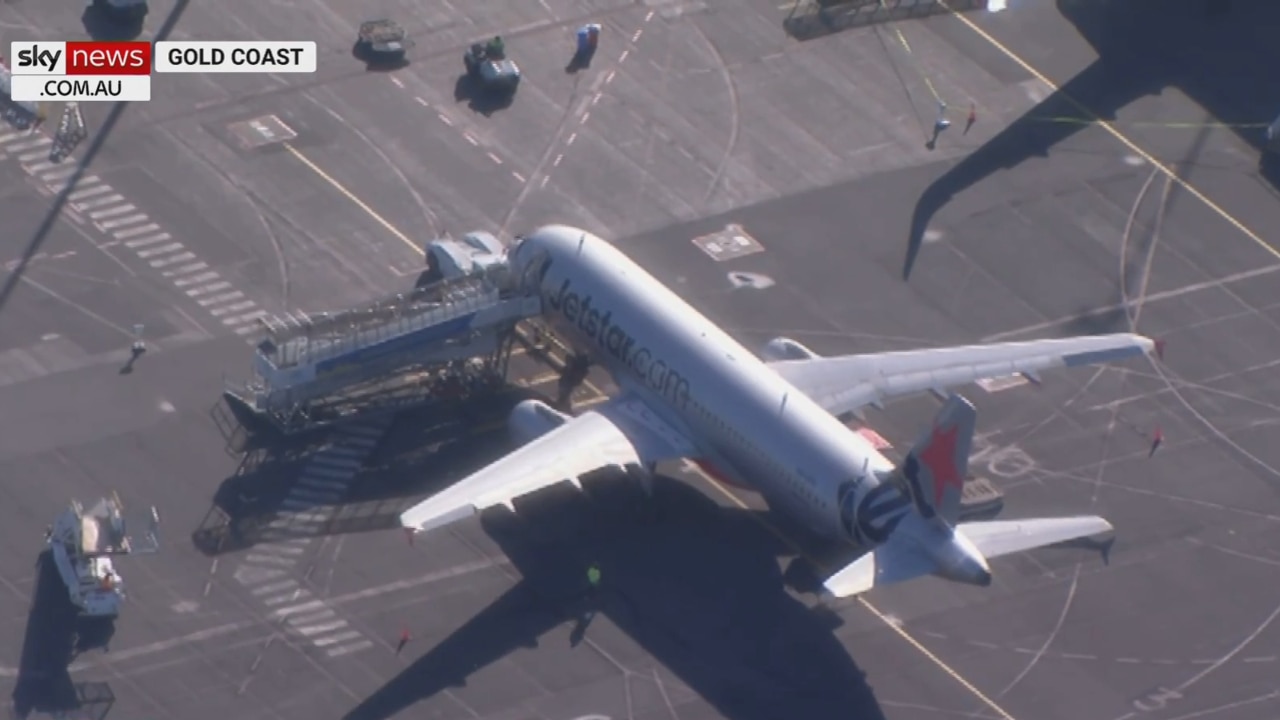 Flight from Sydney touches down on Queensland's Gold Coast amid border reopening