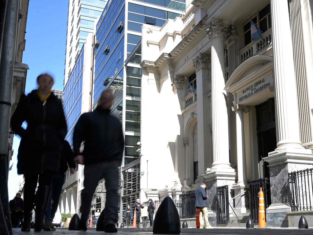 People walk past Argentina’s Central Bank in Buenos Aires. Picture: Juan Mabromata/AFP