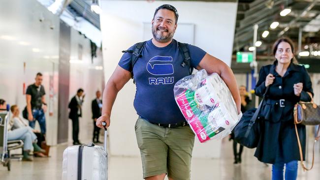 Aaron Jensen is celebrating after arriving back in the country just before the government’s quarantine measures begin and he found toilet paper – in Auckland. Picture: Tim Carrafa