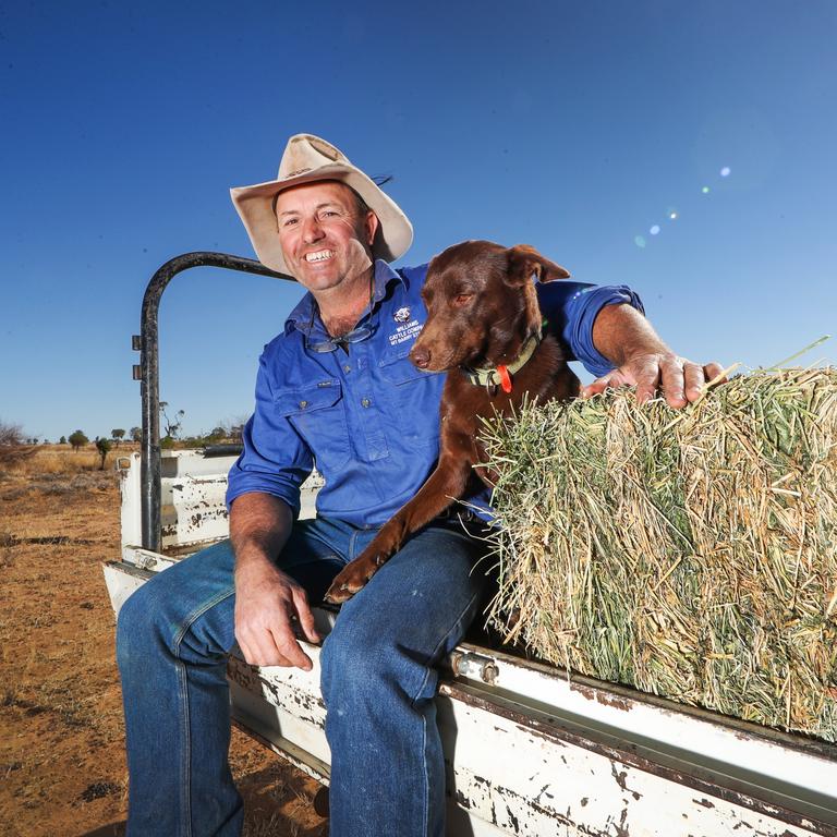 Longreach grazier Dominic Burden and his dog Ollie. “Everything is perfect, except for the weather,’’ Mr Burden says. August, 2018. Picture: Nigel Hallett