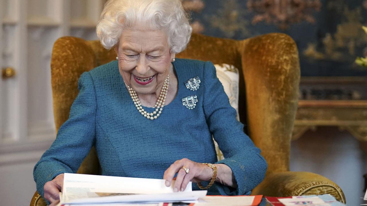 Queen Elizabeth II views a display of memorabilia from her Golden and Platinum Jubilees in the Oak Room at Windsor Castle in February. Picture: Steve Parsons-WPA Pool/Getty Images