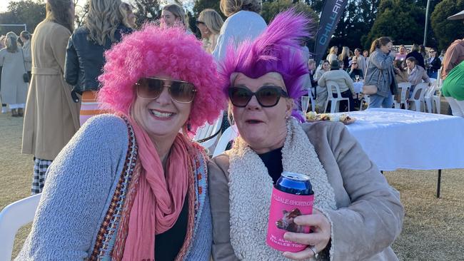 Women sporting pink coifs to get into the spirit of Ladies Day. Picture: Tijana Birdjan