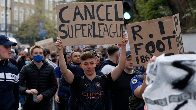 Football supporters demonstrate against the proposed European Super League outside of Stamford Bridge football stadium in London. Picture: Adrian Dennis/AFP