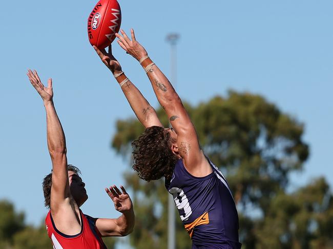 Luke Jackson flies for a mark in Fremantle’s pre-season clash against Melbourne.