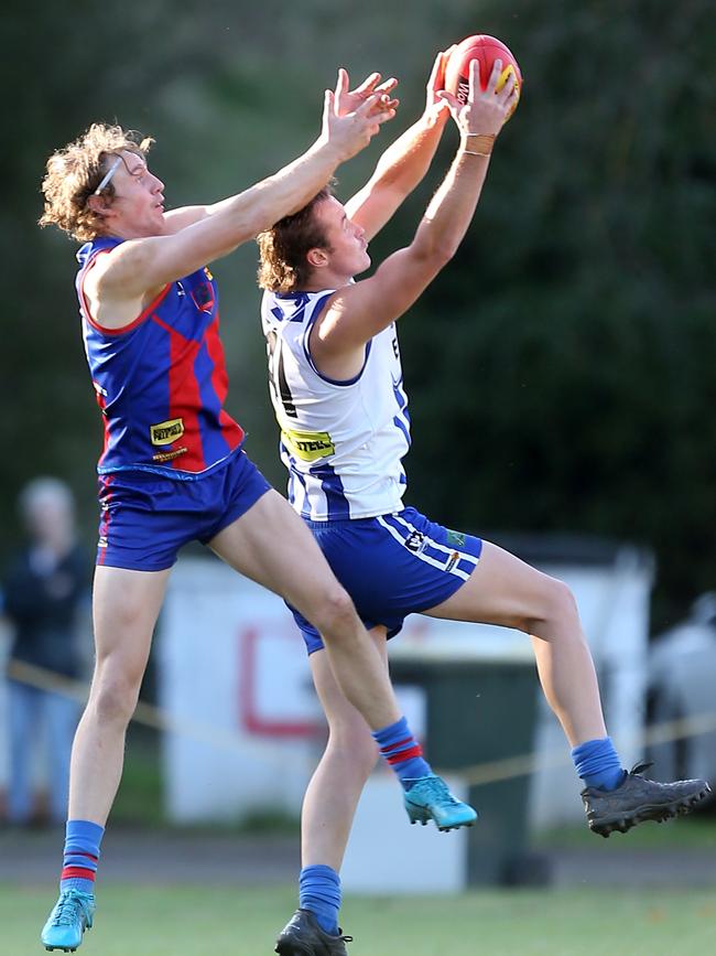 Yackandandah’s Logan Martin marks in front of Beechworth’s Degan Dolny.